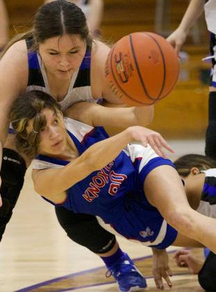 Jaden Baxter makes the pass as she goes to the floor. | SHERI BATY PHOTO