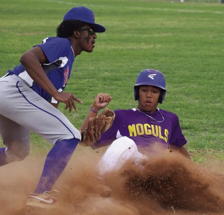 MHS slides into third while KCs Devin Guillory tries to protect the base. | SHERI BATY PHOTO