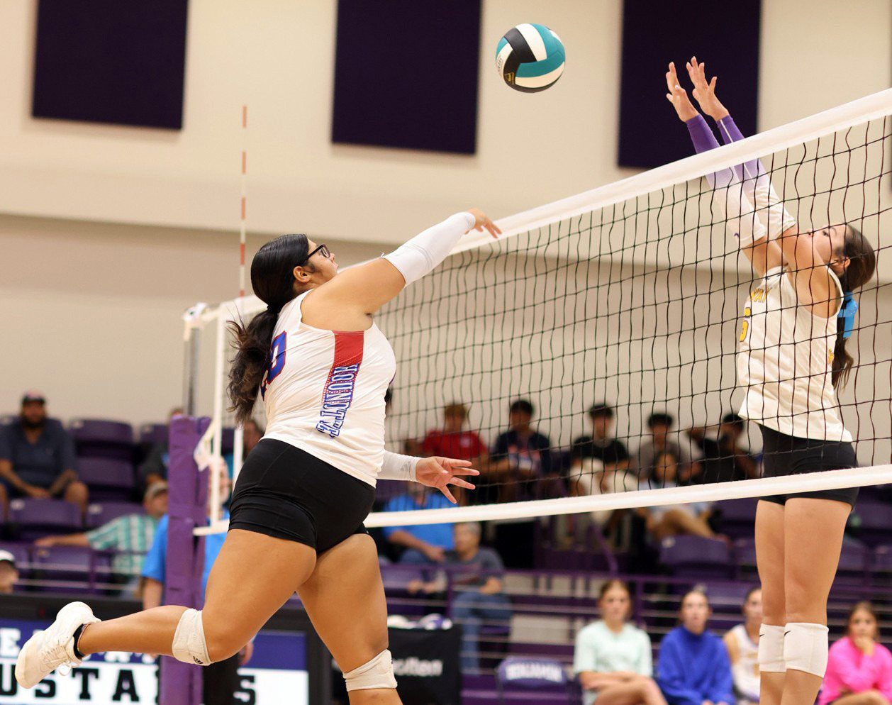 JUST A BITTOO HIGH Audrey Perez works to get the ball past the Mogulette blocker. Knox City won 3-1 in Benjamin on Sept. 19.
