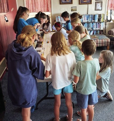 POTIONS CLASS Readers in the summer reading program at the library enjoyed making magic potions the way Harry Potter learned at the Hogwarts School ofWitchcraft andWizardry. | AMANDA BURBANK PHOTO