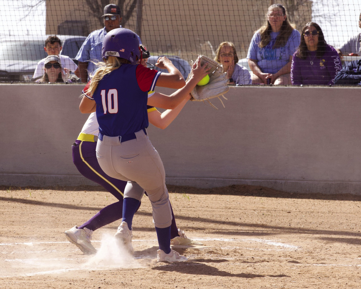 MHS pitcher Ambry Myers covers homeplate but Kinlee Eaton scores the run for the Houndettes | SHERI BATY PHOTO