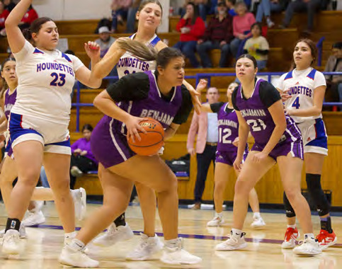 BACK-AND-FORTH BATTLE The Lady Stang grabs the rebound during last week’s January 23, game. The Lady Stangs were hoping to play the spoiler role to earn their first district win of the season but came up short losing to the Houndettes 44-21. | SHERI BATY PHOTO