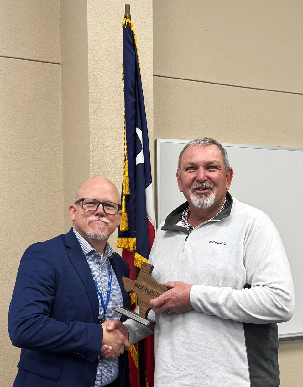 SERVICE TO EDUCATION Kenny Miller (left), deputy executive director of the Region 9 Education Service Center, was among those thanking retired Munday CISD superintendentTroy Parton for a decade-plus of service to the district. | COURTESY PHOTO