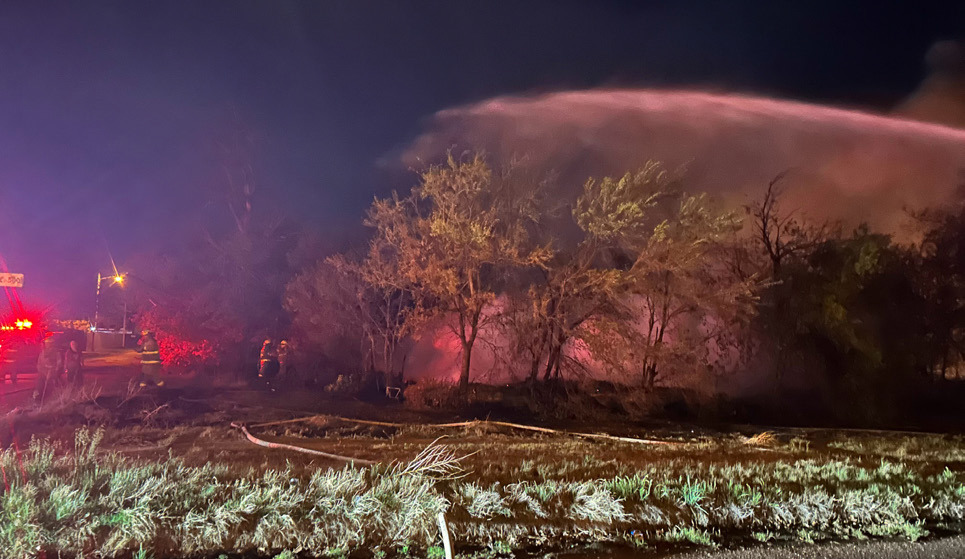 FLAMESUPPRESSION MundayVFD used a water cannon to cover the area where a two-story house once stood. | TROY PARTON
