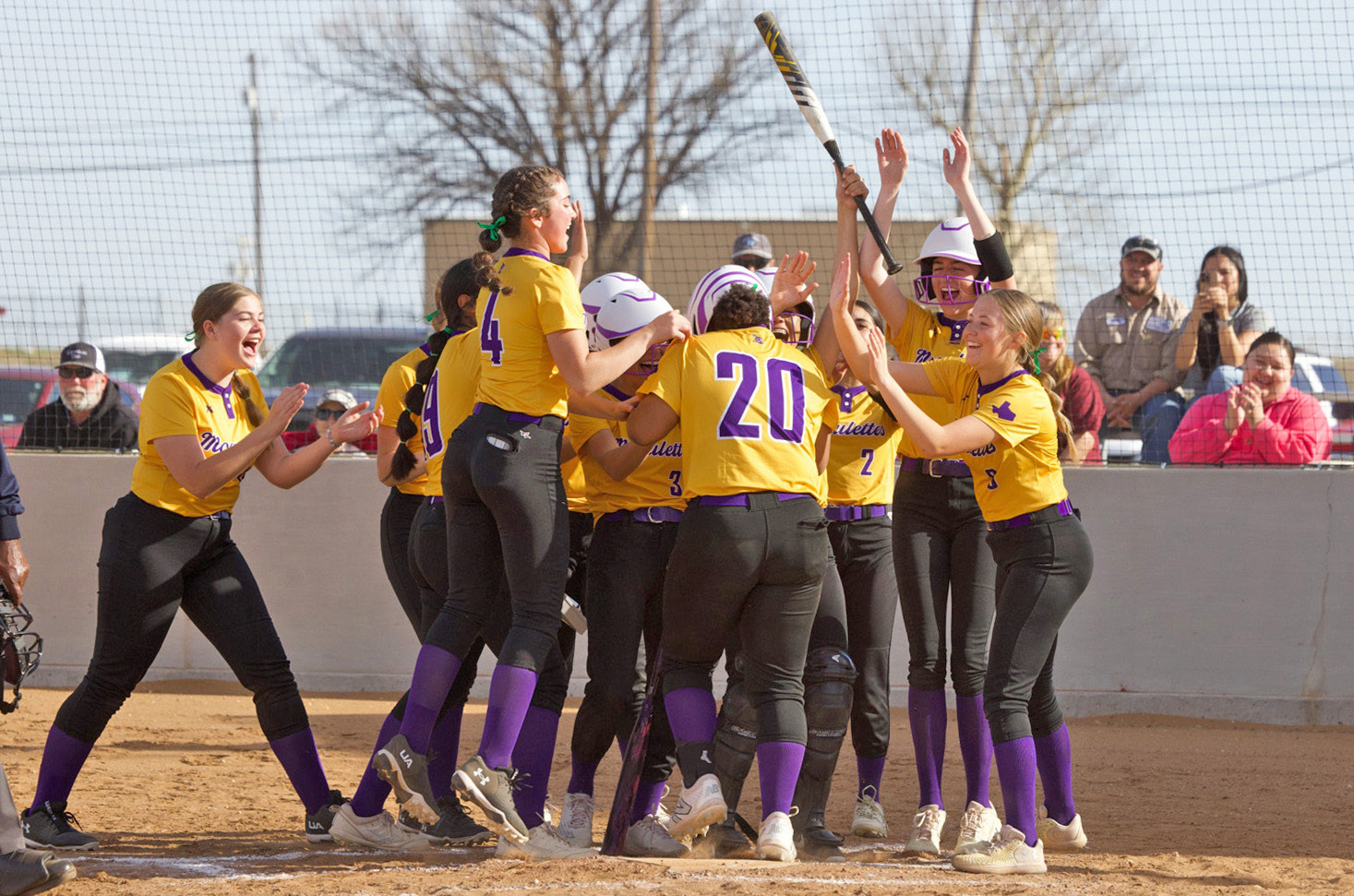 BATTLE OF KNOX COUNTY In the KCHS versus Munday softball game on Tuesday, March 17, the Mogulettes took the win over the Houndettes by the score of 25-3, celebrating the second of two over-the-fence home runs. FULL STORY, PAGE 6 | SHERI BATY PHOTO