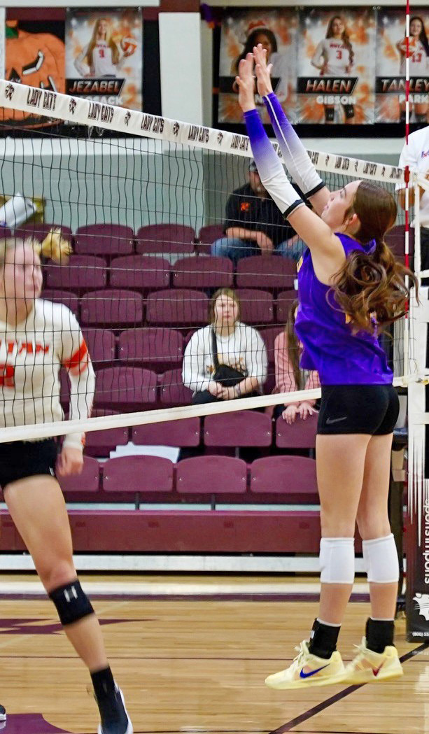 EXCELLENT BLOCKING Munday’s Olivia Myers makes a block at the net. | LACI BOWMAN PHOTO
