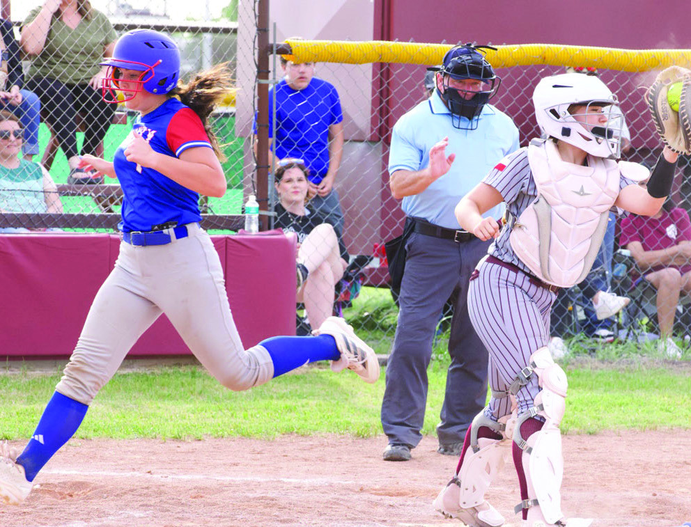 Savannah Friddle crosses the plate. | SHERI BATY PHOTOS