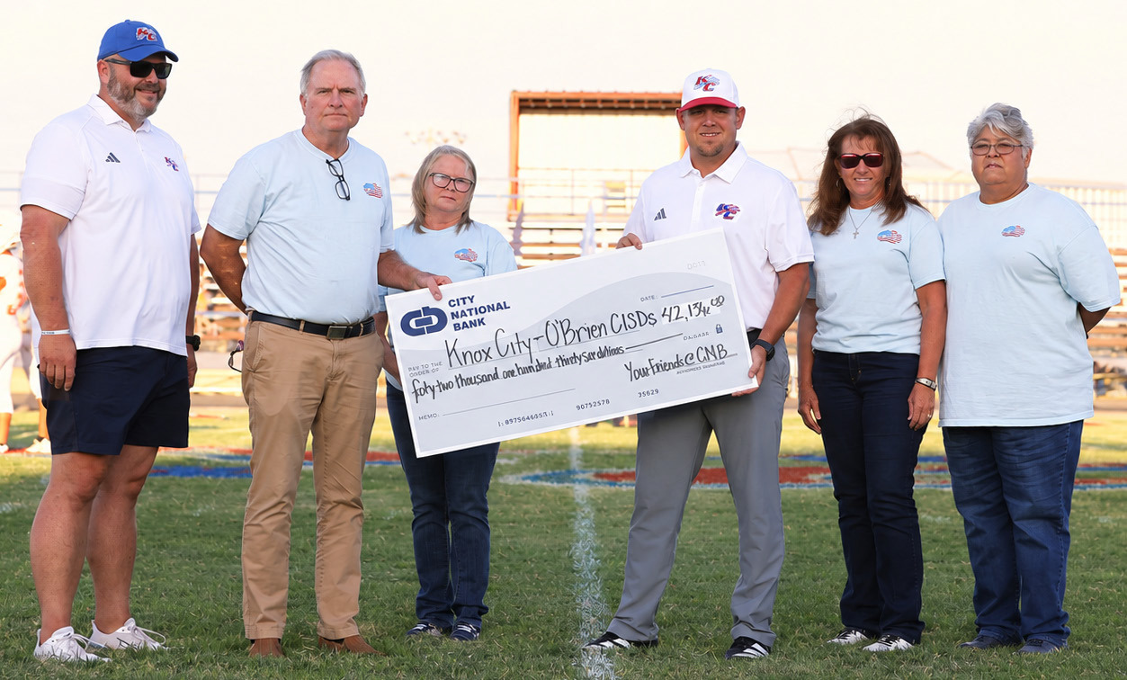 A MAJOR INVESTMENT City National Bank CEO presented Knox City coach Caleb Callaway with the check to purchase a new scoreboard and play clocks. On hand for the cerreomnywere,fromleft,Colin Howeth, Superintendent, Knox City O’Brien CISD; Wrey Montgomery, CEO, City National Bank; Caleb Callaway, Athletic Director/Head Football Coach, Knox City; Shyanne Scholl, COO, City National Bank, LaDonna Smith, Knox City Market President; and Faby Ledesma Vasquez, Knox City, City National Bank | COURTESY PHOTO