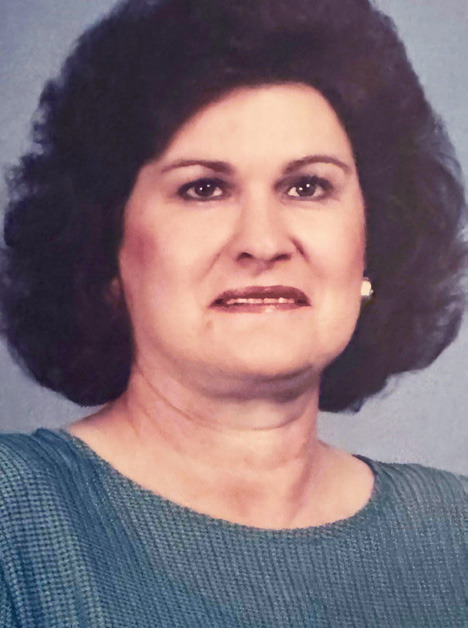 ZORA B. WOODS