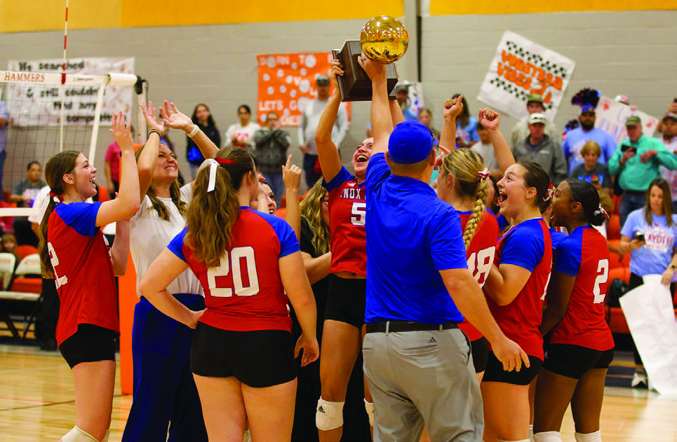 RAISING THE TROPHY The Houndettes celebrate the Bi-District win over Trent | SHERI BATY PHOTO