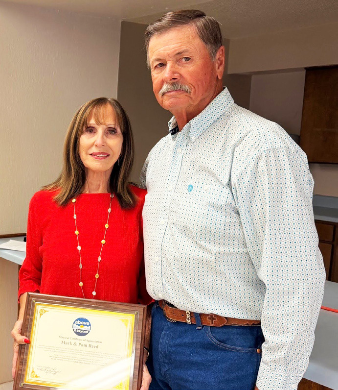 ABOVE AND BEYOND Pam and Mark Reed were recognized for duty Above and Beyond, with an award presented by Munday mayor Karen Longan during the city council meeting July 14. | NEWS-COURIER