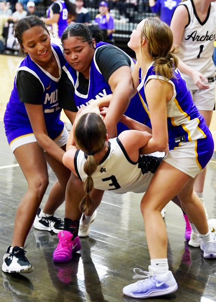LOOSE BALL The Munday Mogulettes hustled after a loose ball in last week’s game against Archer City. The Mogulettes were defeated 51-43, however they turned it around with a win over Rule 42-22. | LACI BOWMAN PHOTO