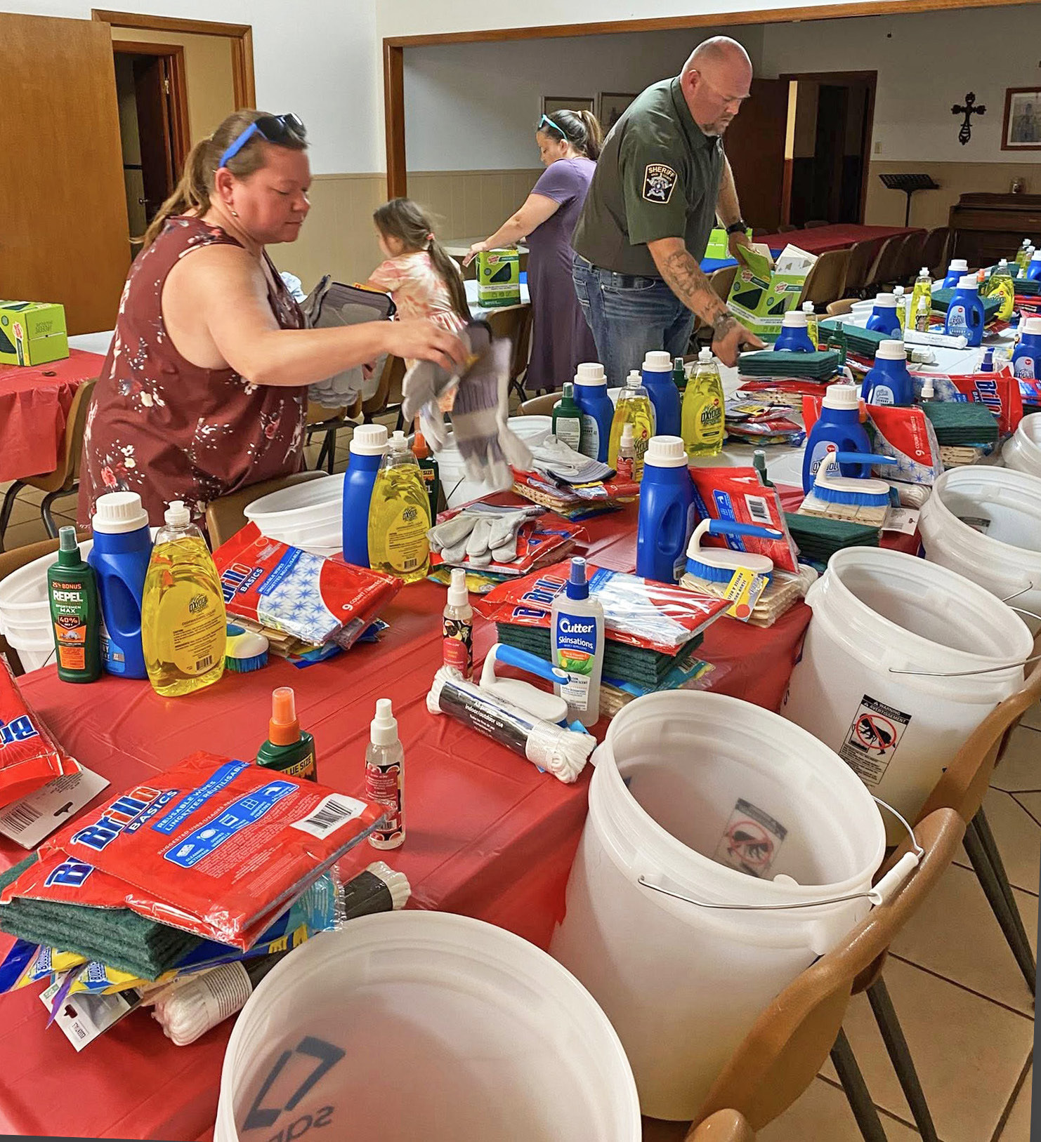 VOLUNTEERS ORGANIZED DONATIONS last week at the Knox City Methodist Church, preparing to pack“flood buckets”of cleaning necessities to help communities recover from flooding in central Texas. | COURTESY PHOTO