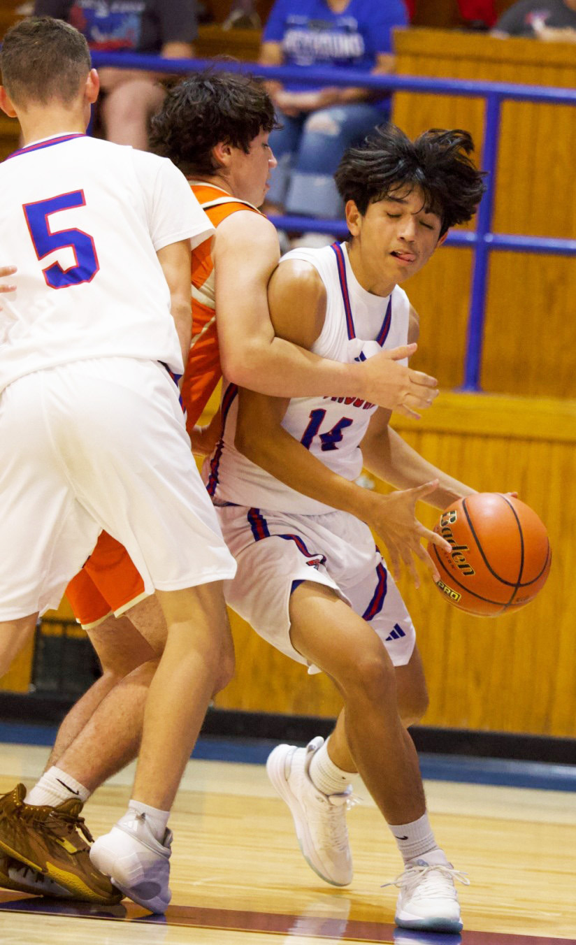 BASELINE TO THE RIM Knox City’s Jaidev Casarez drives the baseline to the rim for two points against Rotan. | SHERI BATY PHOTO