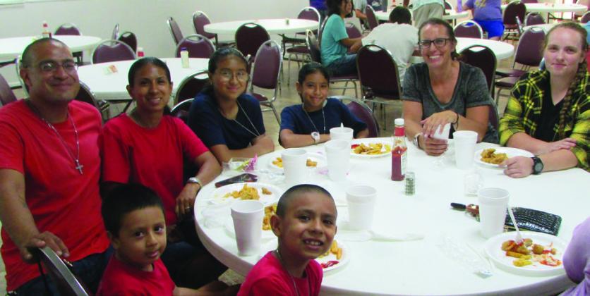 Jesse and Jasmine, family and friends enjoying the Fish Fry. Don Thompson/The Knox County News-Courier