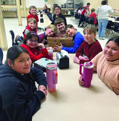 PENNY WARS WINNERS Excited Knox City students enjoying their pizza party reward for winning the Penny Wars. | COURTESY PHOTO