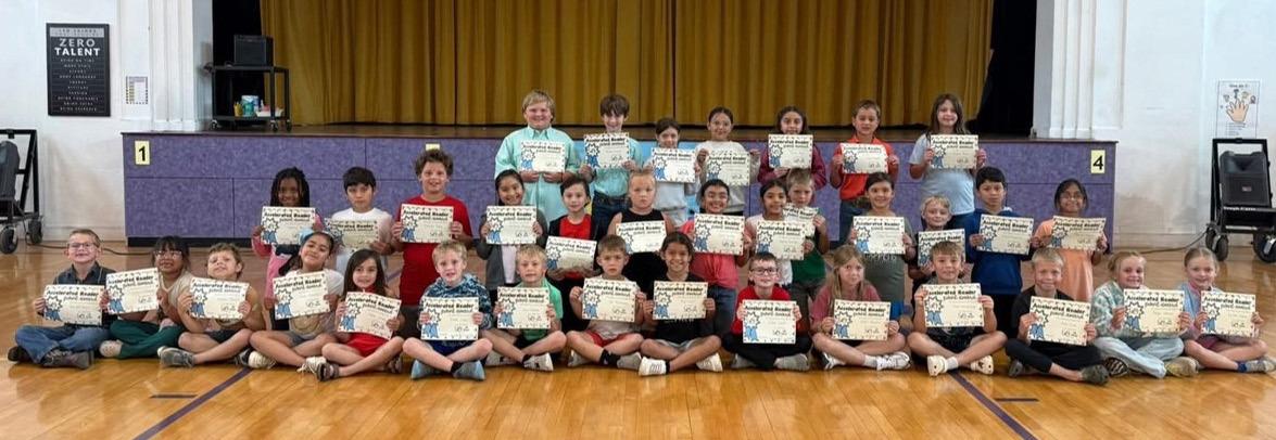 Munday Elem awards AR 50 points club 1st, 2nd, and 3rd graders