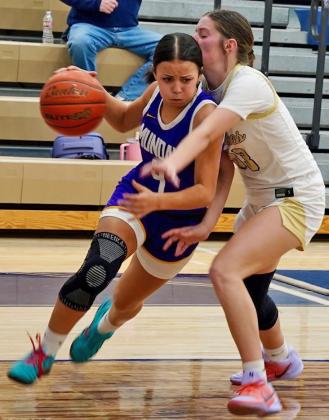 DRIVING THE BASE LINE Ta’Nya Lara drives baseline past a Perrin-Whitt Lady Pirate. The Mogulettes put up a valiant effort but the Lady Pirates had a solid performance and came away with the win, 45-32.