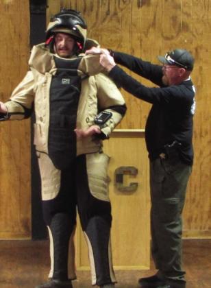 BOMB SQUAD OFFICERS DEMONSTRATINGPROTECTIVE SUIT | DON THOMPSON AND COURTESYPHOTOS