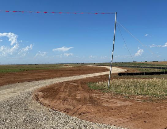 READY FOR TRAFFIC Roads in the sand leading to the ZSS site have been layered with road base and packed down to allow for construction vehicles to navigate around the site easily.