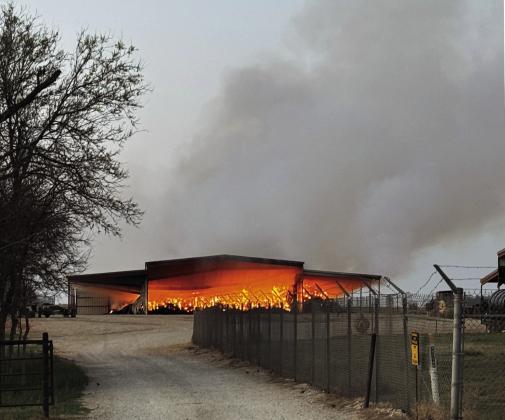 BARNBURNER “This is going to be burning all night,”posted the BenjaminVolunteer Fire Department on Facebook at 10:31 p.m. March 30 while assisting the Knox City VFD in keeping a large hay barn fire under control. This news photograph shows the fire still blazing by Monday morning. | RACHEL FARMER PHOTOS
