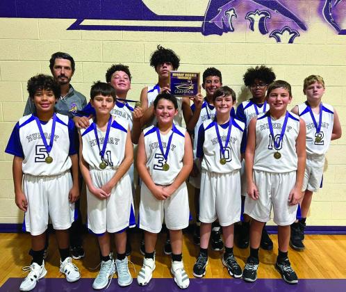 The Junior High Munday Moguls earned the Tournament Champions title this past weekend at their home tournament. The Munday Moguls remained undefeated in all three games of the tournament and earned a combined total of 111 points. The Moguls defeated Aspermont 32-27, Rotan 40-28, and Guthrie 39-33. Pictured here: Back Row: Coach Cory Stephenson, Xavier Flye, Josh Dockins, Casein Lee, Jordan Copeland. Front Row: Jermane Dockins, Bentley Irons, Bryson Nunez, Jon Hunter, Kayton Shahan Courtesy Photo