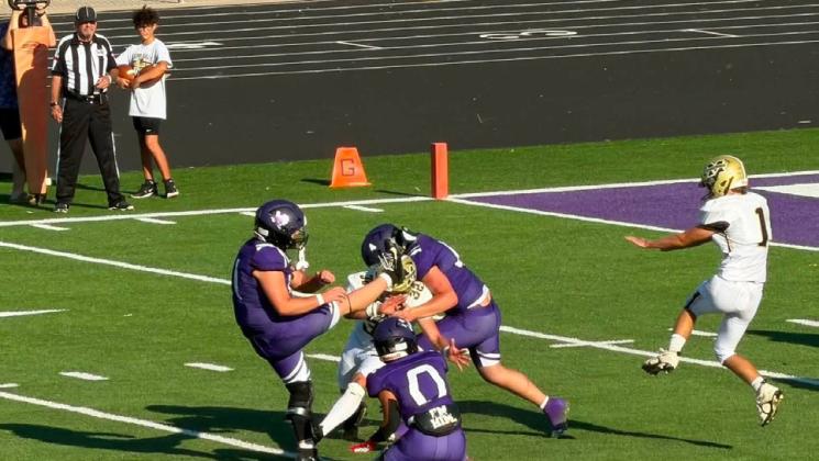 KICKING INTO A CYCLONE This extra-point attempt had to travel past a pair of Cyclones Aug. 27; Mustangs ended the game early per the mercy rule. | COURTESY PHOTO