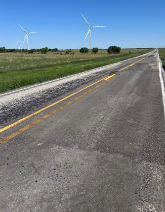 RURAL ROADS can suffer damage during periods of heavy-truck hauling for large construction projects—at times posing problems for motorist safety and eventual cost of repairs. | TROY PARTON