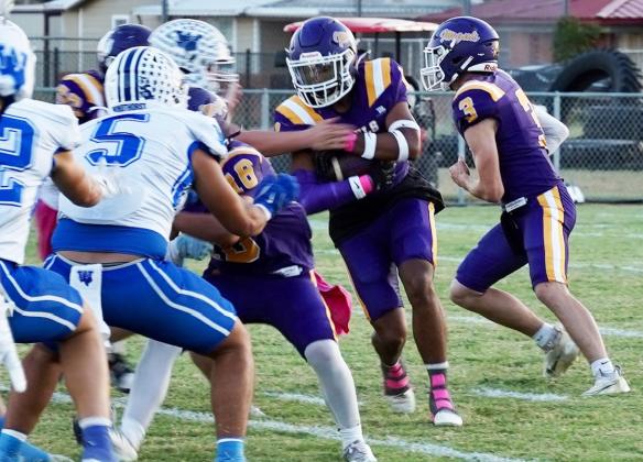 BREAKING THROUGH Mogul Kiyryn Wilson carries the ball through a tough Windthorstdefense, in Friday night’s game that resulted in a loss for the Moguls with a final score of 76-6. | LACIBOWMAN PHOTO