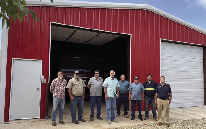 NEW HOUSING FOR FIRETRUCKS BenjaminVFD Chief Stephen Bisbee and Asst Chief Jacob Siemens thank the Knox County Judge and County Commissioners at completion of the project. | DON THOMPSON PHOTO