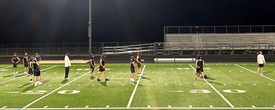 UNDERTHELIGHTS, the Mustangs ran through their passing trees Monday morning under the direction of Coach Kuehler.