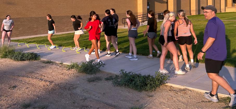 COACH PROPPS stresses quickness as part of the Lady Mustangs’ workout early Monday morning.
