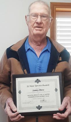 35 YEARS OF SERVICE Sammy Pierce has been serving on the Wichita-Brazos Soil and Water Conservation Board for 35 years. At the meeting held on December 10, he was presented with a plaque for his years of service. The State Soil andWater Conservation Board along with the local board appreciate Sammy’s continued service. | COURTESY PHOTO