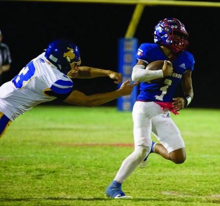 POSITIVE GAIN Zander Abila breaks the tackle to gain some yardage. | SHERI BATY PHOTO