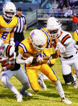 MOGULS GAIN YARDS Quarterback Haiden Bowman gets some positive yards for the Moguls. | LACI BOWMAN