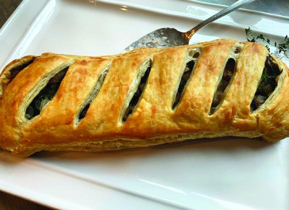 DECADENT BUT LIGHT While the pastry crust for this dish is decadent, filled with light ingredients like mushrooms, spinach, and caramelized onions, it doesn’t make me fill stuffed. | ANGELINA LaRUE PHOTO