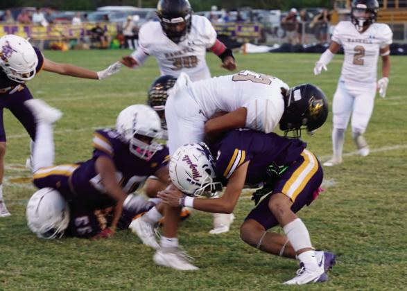 FRIDAY NIGHT KICKOFF Josh Dockins tackles the runner on the opening kickoff. | LACI BOWMAN