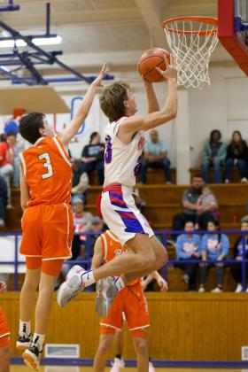 Bryson Callaway hops to the net for the two points. | SHERI BATY PHOTO
