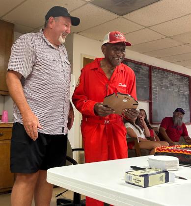 90 YEARS ON EARTH Munday’s VFD secretary presented Cooks with a plaque recognizing 44 years of service and 90 years of life, inscribed with John 3:16, Cooks’s favorite scripture. | COURTESY PHOTO