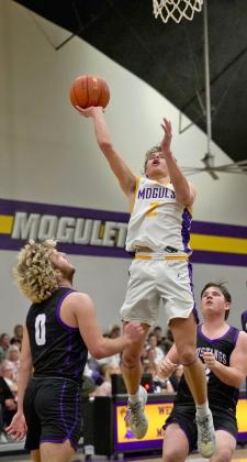 PREVENTING A COMEBACK Luke Bowman drives the lane for two as Munday and Benjamin entered the game tied for first place in the district standings. The Mustangs put forth a valiant fight and showed why they were ranked in the preseason, but Munday was able to prevent Benjamin from mounting a comeback. The #6 Moguls defeated Benjamin 75-51. | LACI BOWMAN PHOTO