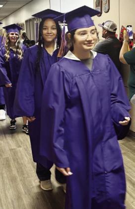 MUNDAY GRADUATES WALK HALLWAYS