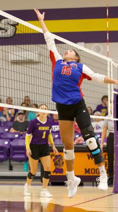 Krystabel Vasquez gets the tip over the net | SHERI BATY/NEWS-COURIER