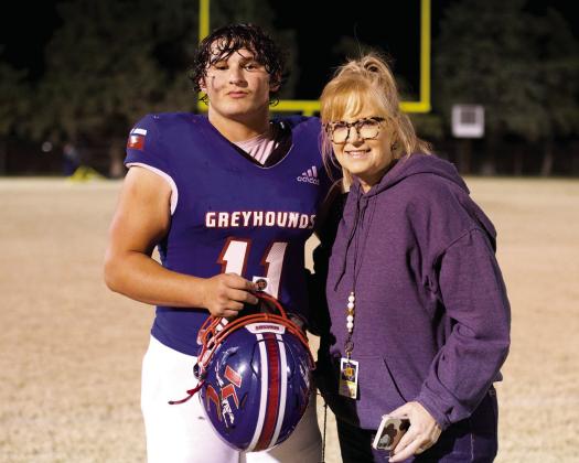 PLAYER OF THE GAME Tristin Baxter and Texas 1A Fan Photographer Johnna Reynolds who presented him the player of the game sticker. | SHERI BATY PHOTO