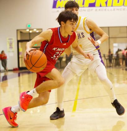 PUSHINGFORTHENET Knox City’s IzaiahTrevino pushes his way to the net versus the Munday Moguls. Munday dominated the game from the opening tip. The Greyhounds were able to score, but Munday kept pulling away to win the game 68-22. | SHERI BATY PHOTO