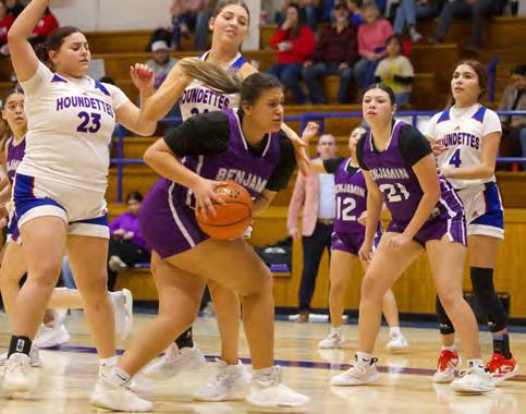 BACK-AND-FORTH BATTLE The Lady Stang grabs the rebound during last week’s January 23, game. The Lady Stangs were hoping to play the spoiler role to earn their first district win of the season but came up short losing to the Houndettes 44-21. | SHERI BATY PHOTO