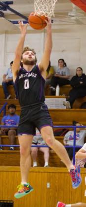 HIGH JUMP FOR THE NET Benjamin’s Keegan Hayes jumps high for the net in last week’s game January 3. The Mustangs prevented the Greyhounds from generating any consistency and pulled away to win the game 70-49. | SHERI BATY PHOTO