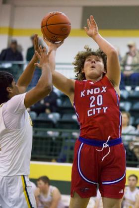 WORKINGTHELANE Knox City Greyhound Camden Swanson works the lane in Saturday’s game versus Guthrie.
