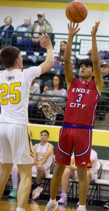 (left) GOING FOR THE JUMP SHOT Greyhound Nathan Martinez goes up with the jumper against Guthrie and comes out on top during the Roddy Shipman Classic Tournament winning the event 49-34.