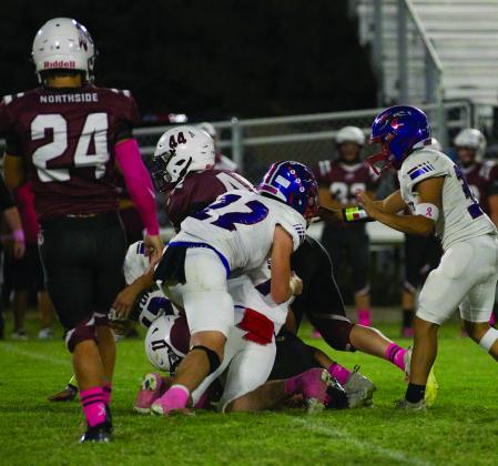 The Northside offense meets the brick wall of the KC Greyhound defense. | SHERI BATY PHOTO