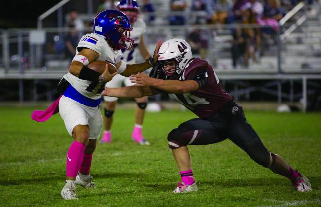 Cameron Hernandez pushes the Northside Indian back to gain a more yards. | SHERI BATY PHOTO